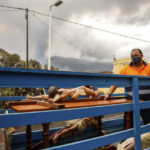 
              Crucifixes of Jesus Christ lie in the back of a truck after being saved from the San Pio X church in El Paso on the island of La Palma in the Canaries, Spain, Monday, Sept. 20, 2021. Giant rivers of lava are tumbling slowly but relentlessly toward the sea after a volcano, seen in backround, erupted on a Spanish island off northwest Africa. The lava is destroying everything in its path but prompt evacuations helped avoid casualties after Sunday's eruption.(Kike Rincon, Europa Press via AP)
            