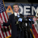
              California Gov. Gavin Newsom addresses reporters after beating back the recall attempt that aimed to remove him from office, at the John L. Burton California Democratic Party headquarters in Sacramento, Calif., Tuesday, Sept. 14, 2021. (AP Photo/Rich Pedroncelli)
            