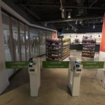A "Just Walk Out" technology-enabled store is shown inside Climate Pledge Arena, Wednesday, Oct. 20, 2021, during a media tour ahead of the NHL hockey Seattle Kraken's home opener Saturday against the Vancouver Canucks in Seattle. The historic angled roof of the former KeyArena was preserved, but everything else inside the venue, which will also host concerts and be the home of the WNBA Seattle Storm basketball team, is brand new. The technology-enabled store allows fans to insert a credit card or use their Amazon One device at the location's entry gates to shop for snacks and then just walk away as their purchases are automatically tabulated. (AP Photo/Ted S. Warren)