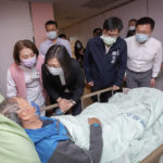 
              In this photo released by the Taiwan Presidential Office, Taiwanese President Tsai Ing-wen, second from left, visits a man injured in a building fire at a hospital in Kaohsiung, southern Taiwan, Saturday, Oct 16, 2021. A fire broke out early Thursday in a run-down mixed commercial and residential building in the Taiwanese port city of Kaohsiung, officials said. (Taiwan Presidential Office via AP)
            