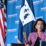 
              In this Tuesday, Sept. 28, 2021, photo Commerce Secretary Gina Raimondo speaks during a conversation with chairman David Rubenstein at The Economic Club of Washington. As President Joe Biden's de facto tech minister, Raimondo is tasked with ensuring the United States will be the world leader in computer chips. But there is a global shortage, creating a drag on growth and fueling inflation on the cusp of the 2022 elections. Raimondo is working to increase production of chips as well as solar panels and batteries to help the United States thrive. (AP Photo/Alex Brandon)
            