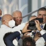 
              U.S. President Joe Biden poses for a selfie with medical personnel and other world leaders during a group photo at the La Nuvola conference center for the G20 summit in Rome, Saturday, Oct. 30, 2021. The two-day Group of 20 summit is the first in-person gathering of leaders of the world's biggest economies since the COVID-19 pandemic started. (AP Photo/Gregorio Borgia)
            
