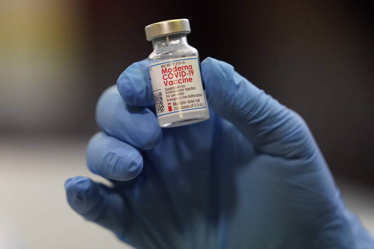FILE - This Tuesday, Jan. 5, 2021 file photo shows a vial of the Moderna COVID-19 vaccine at a pop-...