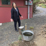 
              In this Tuesday, Oct. 5, 2021, photo, Dawn Rasmussen stands at her well at her property on the outskirts of The Dalles, Oregon. She says the water table that her well draws from has dropped 15 feet in the last 15 years. She has deep concerns about Google's proposal to build more data centers, which use vast amounts of water, in the town. The city council is expected to vote soon on Google's proposal. As demand for cloud computing grows, the world's biggest tech companies are building more data centers, including in arid regions even though they use vast amounts of water per day. (AP Photo/Andrew Selsky)
            