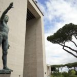 
              FILE - In this Monday, May 6, 2019 file photo, a bronze sculpture by Italo Griselli, known under the Fascist regime as "Saluto Fascista" (Fascist Salute) and after the war renamed Genio dello Sport (Genius of Sport), stands at the entrance of a fascist architecture building in the EUR neighborhood, in Rome. An extreme-right political party's violent exploitation of anger over government anti-pandemic restrictions is forcing Italy to wrestle with its fascist legacy and fueling fears that there could be a replay of last week's mobs trying to force their way toward Parliament.. (AP Photo/Andrew Medichini)
            