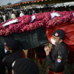 
              FILE - In this July 30, 2021 file photo, Police officers carry a casket of their colleague, who was killed in a grenade attack, during a funeral prayer, in Peshawar, Pakistan. The Taliban win in Afghanistan is giving a boost to militants in neighboring Pakistan. The Pakistani Taliban, known as the TTP, have become emboldened in tribal areas along the border with Afghanistan.  (AP Photo/Muhammad Sajjad, File)
            