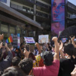 
              People protest outside the Netflix building on Vine Street in the Hollywood section of Los Angeles, Wednesday, Oct. 20, 2021. Critics and supporters of Dave Chappelle's Netflix special and its anti-transgender comments gathered outside the company's offices Wednesday, with "Trans Lives Matter" and "Free Speech is a Right" among their competing messages. (AP Photo/Damian Dovarganes)
            