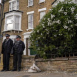 
              Police officers stand outside a house in north London, thought to be in relation to the death of Conservative MP Sir David Amess, Sunday, Oct. 17, 2021. Leaders from across Britain's political spectrum have come together to pay tribute to a long-serving British lawmaker who was stabbed to death in what police have described as a terrorist attack. (AP Photo/Alberto Pezzali)
            
