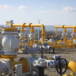 
              Men walk next to pipelines of the national natural gas distribution network outside Ungheni, Moldova, March 4, 2015. The country faces a looming natural gas supply shortage this winter after it failed to renew a long-term contract with Russia, as on Tuesday, Oct. 26, 2021, the former Soviet republic received a million cubic meters of gas from Poland, the first time in history it has turned to a non-Russian supplier, amid increasing geopolitical tensions as Moldova looks to forge closer ties with the European Union after for years being under strong Russian influence.(AP Photo/Aurel Obreja)
            