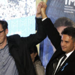 
              Conservative independent candidate Peter Marki-Zay, right, celebrates with Budapest's Mayor Gergely Karacsony in Budapest, Hungary, Sunday, Oct. 17, 2021, after he won an opposition primary race in Hungary, making him nominee of a six-party opposition coalition who will lead a challenge to right-wing populist Prime Minister Viktor Orban in national elections next spring . (AP Photo/Laszlo Balogh)
            