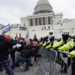 
              FILE - In this Jan. 6, 2021 file photo, Trump supporters try to break through a police barrier at the Capitol in Washington. A House committee tasked with investigating the Jan. 6 Capitol insurrection is moving swiftly to hold at least one of Donald Trump’s allies, former White House aide Steve Bannon, in contempt. That's happening as the former president is pushing back on the probe in a new lawsuit. (AP Photo/Julio Cortez)
            
