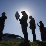 
              Members of the United Auto Workers strike outside of the John Deere Engine Works plant on Ridgeway Avenue in Waterloo, Iowa, on Friday, Oct. 15, 2021. About 10,000 UAW workers have gone on strike against John Deere since Thursday at plants in Iowa, Illinois and Kansas.(Bryon  Houlgrave/The Des Moines Register via AP)
            