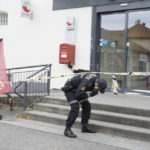 
              Police search for evidence outside the Coop store in after a man killed several people, in Kongsberg, Norway, Thursday, Oct. 14, 2021. Police in Norway are holding a 37-year-old man from Denmark suspected in a bow-and-arrow attack in a small town that killed five people and wounded two others. (Terje Pedersen/NTB via AP)
            