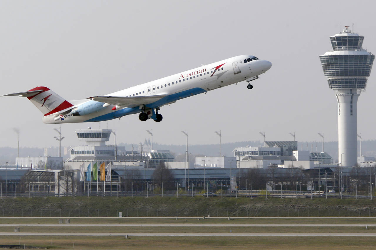 FILE - In this April 1, 2014 file photo, a Austrian Airlines airplane takes off from the airport in...