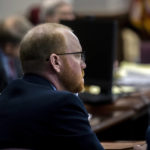 
              Travis McMichael listens to attorneys question a pool of prospective jurors during jury selection for the trial of he and his father Greg McMichael and William "Roddie" Bryan, at the Glynn County Courthouse, Monday, Oct. 25, 2021, in Brunswick, Ga. The trio are charged with the slaying of 25-year-old Ahmaud Arbery in February 2020. (AP Photo/Stephen B. Morton, Pool)
            