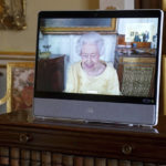 
              Queen Elizabeth II appears on a screen via videolink from Windsor Castle, where she is in residence, during a virtual audience at Buckingham Palace, London, Tuesday, Oct. 26, 2021. (Victoria Jones/Pool via AP)
            