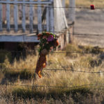 
              A bouquet of flowers is left to honor cinematographer Halyna Hutchins outside the Bonanza Creek Ranch in Santa Fe, N.M., Sunday, Oct. 24, 2021. Hutchins died after actor Alec Baldwin fired a fatal gunshot from a prop gun that he had been told was safe. (AP Photo/Jae C. Hong)
            