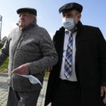 
              Poland's chief rabbi, Michael Schudrich, right, supports 94-year-old Boleslaw Sitarz, a witness to an execution by Nazi Germans of dozens of Jews during the Holocaust in Wojslawice, Poland, Thursday Oct. 14, 2021. On Thursday a grave was dedicated in Wojslawice to the victims, one of many in recent years to be discovered, secured and marked. (AP Photo/Czarek Sokolowski)
            