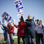 
              Members of the United Auto Workers strike outside of the John Deere Engine Works plant on Ridgeway Avenue in Waterloo, Iowa, on Friday, Oct. 15, 2021. About 10,000 UAW workers have gone on strike against John Deere since Thursday at plants in Iowa, Illinois and Kansas.(Bryon  Houlgrave/The Des Moines Register via AP)
            