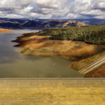 
              Clouds gather over Lake Oroville on Monday, Oct. 25, 2021, in Oroville, Calif. Recent storms raised the reservoir more than 16 feet, according to the California Department of Water Resources. (AP Photo/Noah Berger)
            
