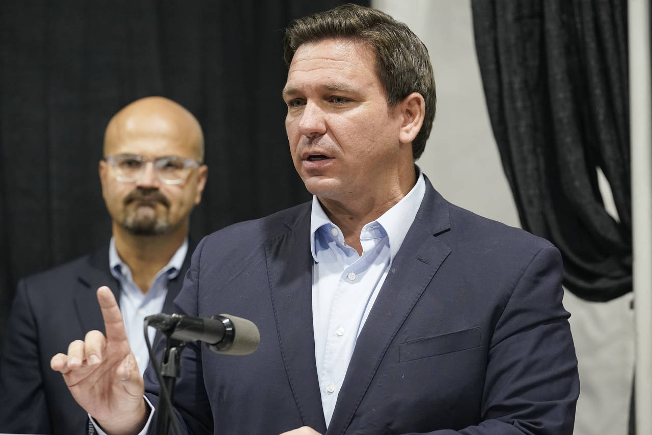 FILE - Florida Gov. Ron DeSantis speaks at the opening of a monoclonal antibody site Wednesday, Aug...