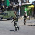 
              Indian paramilitary soldiers stand guard on a road leading towards the site of a gunfight in Pampore, south of Srinagar, Indian controlled Kashmir, Saturday, Oct. 16, 2021. Indian government forces killed five rebels in last 24-hours in disputed Kashmir on Saturday, officials said, as violence increased in recent weeks.(AP Photo/Dar Yasin)
            
