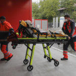 
              Paramedics bring an elderly patient to the emergency room, turned into a CODIV-19 unit due the high number of cases, at the Bagdasar-Arseni hospital in Bucharest, Romania, Tuesday, Oct. 12, 2021. Romania reported on Tuesday nearly 17,000 new COVID-19 infections and 442 deaths, the highest number of coronavirus infections and deaths in a day since the pandemic started, as the nation's health care system struggles to cope with an acute surge of new cases.(AP Photo/Andreea Alexandru)
            