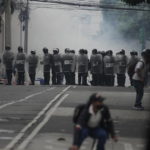 
              Riot police form a cordon during a protest by veterans demanding that a law be passed that compensates them for having served during the country's civil war, outside the Congress building in Guatemala City, Tuesday, Oct. 19, 2021. (AP Photo/Moises Castillo)
            