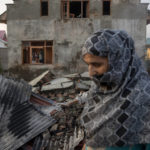 
              Kashmiri villagers inspect the debris of a house destroyed in a gunfight in Pampore, south of Srinagar, Indian controlled Kashmir, Saturday, Oct. 16, 2021. Indian government forces killed five rebels in last 24-hours in disputed Kashmir on Saturday, officials said, as violence increased in recent weeks. (AP Photo/Dar Yasin)
            