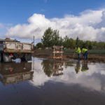 
              Members of Hollister's Department of Public Works clear flood waters on Fairview Road in Hollister, Calif., Monday, Oct. 25, 2021. (AP Photo/Nic Coury)
            
