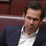 
              Nationals party Senator Matt Canavan sits in the chamber at Parliament House in Canberra, Tuesday, Oct. 19, 2021. A net zero carbon emissions target by 2050 would be a "great positive" for Australia if it can be achieved through technology and not a carbon price, the prime minister said as he pressures government colleagues to commit to more ambitious climate change action ahead of the Glasgow summit. Canavan was among the lawmakers who did not believe the modeling. (Mick Tsikas/AAP Image via AP)
            