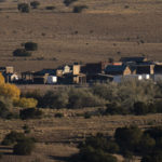 
              The Bonanza Creek Film Ranch is seen in Santa Fe, N.M., Saturday, Oct. 23, 2021.  An assistant director unwittingly handed actor Alec Baldwin a loaded weapon and told him it was safe to use in the moments before the actor fatally shot a cinematographer, court records released Friday show. (AP Photo/Jae C. Hong)
            
