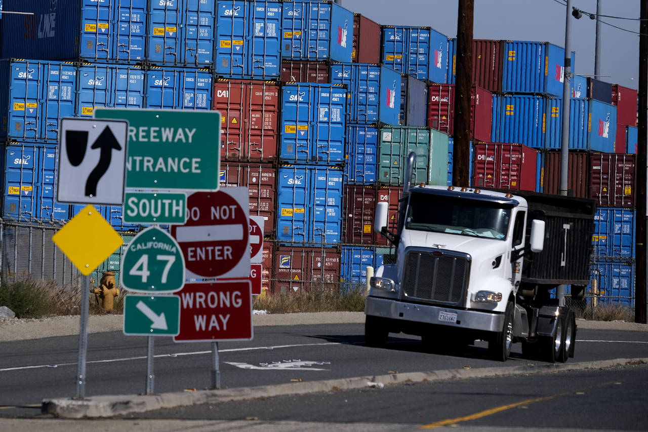 FILE - ,Cargo containers sit stacked at the Port of Los Angeles, Wednesday Oct. 20, 2021 in San Ped...