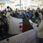 
              People gather during a demonstration Marseille to commemorate the 60th anniversary of the 1961 massacre of Algerians in Paris, Sunday, Oct. 17, 2021. A tribute march was organized on Sunday in Paris for the 60th anniversary of the bloody police crackdown on a protest by Algerians in the French capital, during the final year of their country's independence war with its colonial power. (AP Photo/Daniel Cole)
            