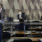 
              Senators Omar Aziz, left, Randolfe Rodrigues, center, and Renan Calheiros, attend a session by the commission investigating the government's management of the COVID-19 pandemic at the Federal Senate in in Brasilia, Brazil, Tuesday, Oct. 26, 2021. (AP Photo/Eraldo Peres)
            