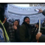 
              This image from Metropolitan Police Department body worm camera video and contained in the Statement of Facts supporting an arrest warrant for Pauline Bauer, pointing second to left, taken in the Rotunda of the U.S. Capitol on Jan. 6, 2021, in Washington. Bauer is one of at least five people charged in the riot at the U.S. Capitol on Jan. 6 who have chosen to defend themselves in court, brushing aside federal judges’ repeated warnings about the risks of trying to navigate their high-stakes cases without an attorney. (Justice Department via AP)
            