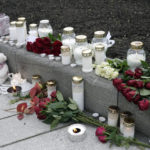 
              Flowers and candles were left after a man killed several people, in Kongsberg, Norway, Thursday, Oct. 14, 2021. Police in Norway are holding a 37-year-old man from Denmark suspected in a bow-and-arrow attack in a small town that killed five people and wounded two others. (Terje Pedersen/NTB via AP)
            