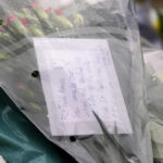 
              A note is seen on a floral tribute near the site where a member of Parliament was killed on Friday, in Leigh-on-Sea, Essex, England, Saturday, Oct. 16, 2021. David Amess, a long-serving member of Parliament was stabbed to death during a meeting with constituents at a church in Leigh-on-Sea on Friday, in what police said was a terrorist incident. A 25-year-old British man is in custody. (AP Photo/Alberto Pezzali)
            