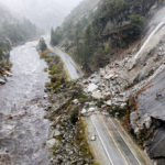 
              Rocks and vegetation cover Highway 70 following a landslide in the Dixie Fire zone on Sunday, Oct. 24, 2021, in Plumas County, Calif. Heavy rains blanketing Northern California created slide and flood hazards in land scorched during last summer's wildfires. (AP Photo/Noah Berger)
            