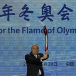 
              Cai Qi, Beijing Communist Party secretary holds up the Olympic torch during a welcome ceremony for the Frame of Olympic Winter Games Beijing 2022, at the Olympic Tower in Beijing, Wednesday, Oct. 20, 2021. A welcome ceremony for the Olympic flame was held in Beijing on Wednesday morning after it arrived at the Chinese capital from Greece. While the flame will be put on display over the next few months, organizers said a three-day torch relay is scheduled starting February 2nd with around 1200 torchbearers in Beijing, Yanqing and Zhangjiakou. (AP Photo/Andy Wong)
            