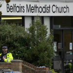 
              A police officer stands guard by the Belfairs Methodist Church where British lawmaker David Amess was killed Friday during a meeting with constituents, in Leigh-on-Sea, Essex, England, Sunday, Oct. 17, 2021. Amess, a long-serving lawmaker, was attacked during a regular meeting with his constituents at a church in Leigh-on-Sea, a town about 40 miles (62 kilometers) east of London.  (AP Photo/Alastair Grant)
            