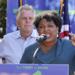 
              Voting rights activist Stacey Abrams, right, speaks during a rally with Democratic gubernatorial candidate, former Virginia Gov. Terry McAuliffe, left, in Norfolk, Va., Sunday, Oct. 17, 2021. Abrams was in town to encourage voters to vote for the Democratic gubernatorial candidate in the November election. (AP Photo/Steve Helber)
            