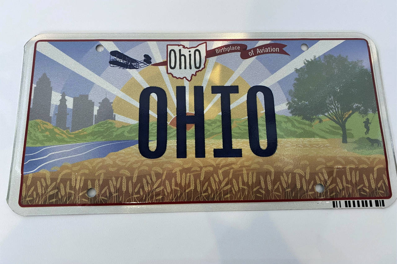 Ohio Gov. Mike DeWine on Thursday, Oct. 21, 2021, unveiled the new "Sunrise in Ohio" license plate ...