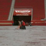 
              Workers push water off a tarp covering the field from rain at Levi's Stadium before an NFL football game between the San Francisco 49ers and the Indianapolis Colts in Santa Clara, Calif., Sunday, Oct. 24, 2021. A powerful storm roared ashore Sunday in Northern California, flooding highways, toppling trees and causing mud flows as forecasters predict record-breaking rainfall. (AP Photo/Jed Jacobsohn)
            