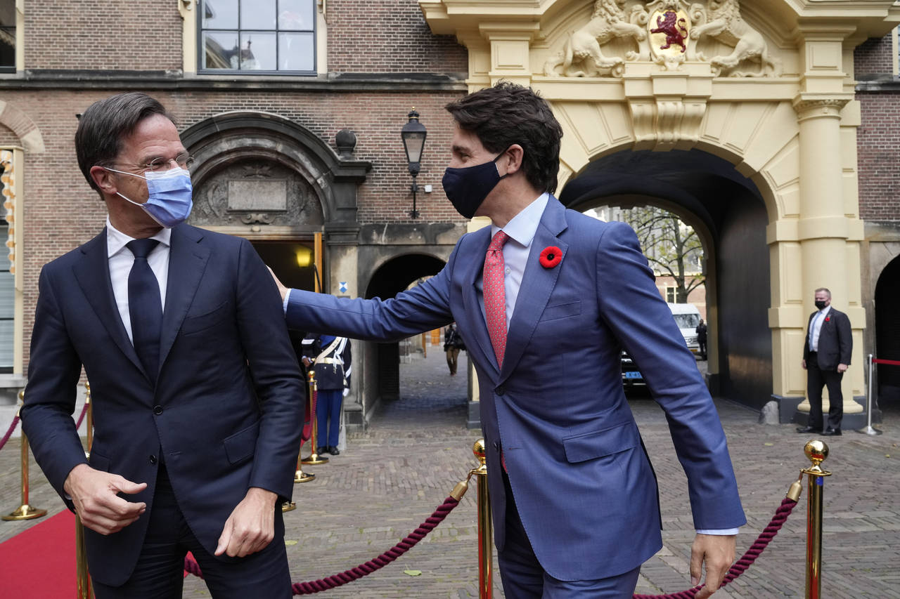 Canada's Prime Minister Justin Trudeau, right, and Dutch caretaker Prime Minister Mark Rutte, greet...