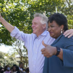 
              Voting rights activist Stacey Abrams, right, and Democratic gubernatorial candidate, former Virginia Gov. Terry McAuliffe, wave to the crowd during a rally in Norfolk, Va., Sunday, Oct. 17, 2021. Abrams was in town to encourage voters to vote for the Democratic gubernatorial candidate in the November election. (AP Photo/Steve Helber)
            