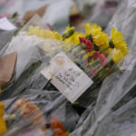 
              A note is seen by floral tributes near the site where a member of Parliament was killed on Friday, in Leigh-on-Sea, Essex, England, Saturday, Oct. 16, 2021. David Amess, a long-serving member of Parliament was stabbed to death during a meeting with constituents at a church in Leigh-on-Sea on Friday, in what police said was a terrorist incident. A 25-year-old British man is in custody. (AP Photo/Alberto Pezzali)
            