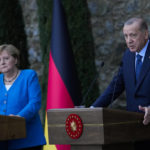 
              Turkey's President Recep Tayyip Erdogan, right, talks to journalists next to German Chancellor Angela Merkel during a joint news conference following their meeting at Huber vila, Erdogan's presidential resident, in Istanbul, Turkey, Saturday, Oct. 16, 2021. The leaders discussed Ankara's relationship with Germany and the European Union as well as regional issues including Syria and Afghanistan. (AP Photo/Francisco Seco)
            