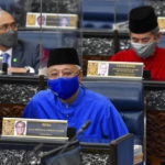 
              In this photo released by Malaysia's Department of Information, Malaysia's Prime Minister Ismail Sabri Yaakob, delivers the 2022 budget speech at parliament in Kuala Lumpur, Malaysia, Friday, Oct. 29, 2021. (Famer Roheni/Malaysia's Department of Information via AP)
            