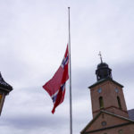 
              The Norwegian flag is at half-mast in Kongsberg the day after a man killed several people, in Kongsberg, Norway, Thursday, Oct. 14, 2021. Police in Norway are holding a 37-year-old man from Denmark suspected in a bow-and-arrow attack in a small town that killed five people and wounded two others. (Terje Bendiksby/NTB via AP)
            